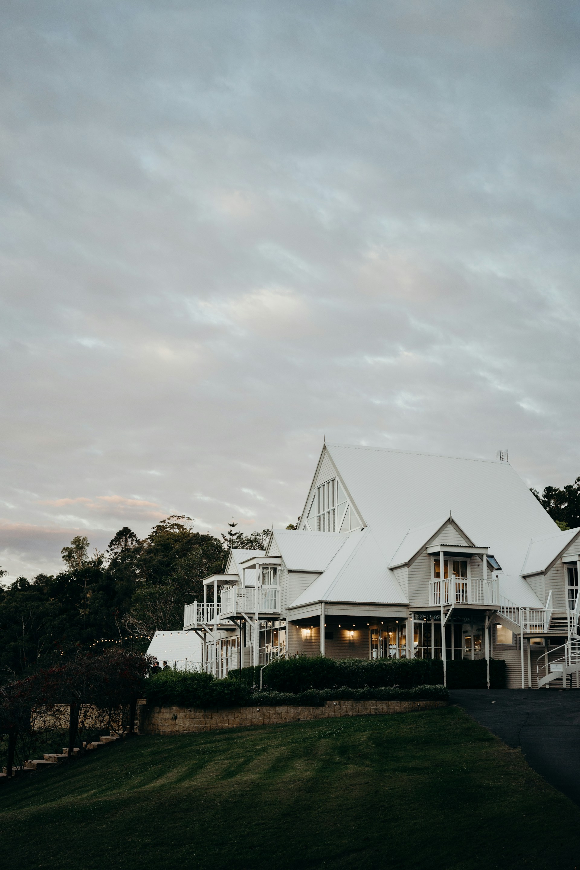 White Queenslander venue in the Noosa hinterland at dusk